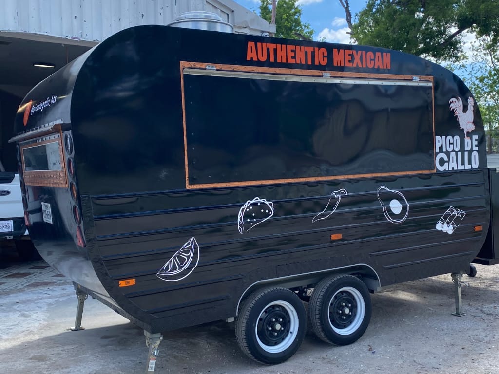 Full Trailer Wrap for a food trailer showcasing custom graphics, high-quality vinyl, and professional branding coverage.